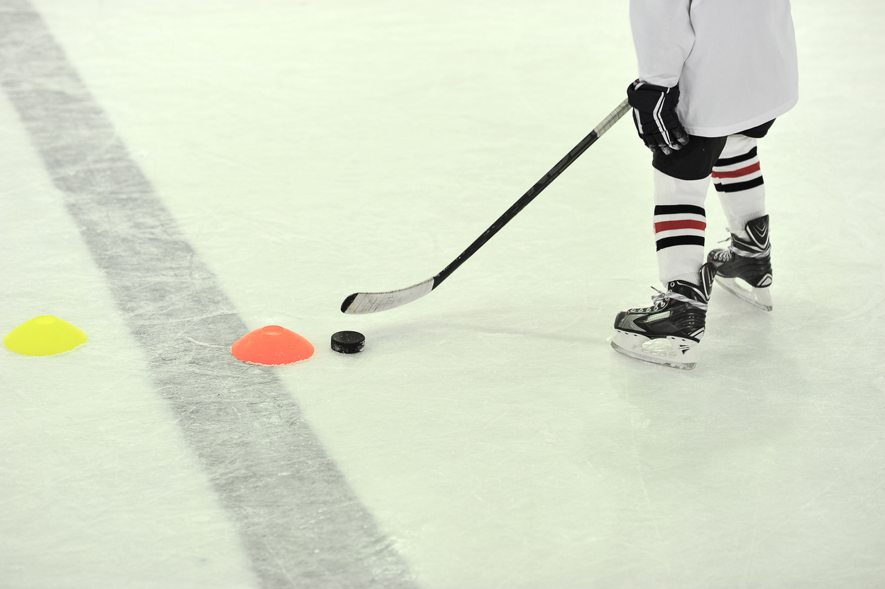 hockey player with the puck on training